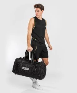 Venum Sports Bag Trainer Lite - Black/camo -Boxing Equipment Store 3c4820dcfb45ee27f675630f46f233ab826c6be3 SPORT BAG TRAINER LITE BLACK DARKCAMO 13